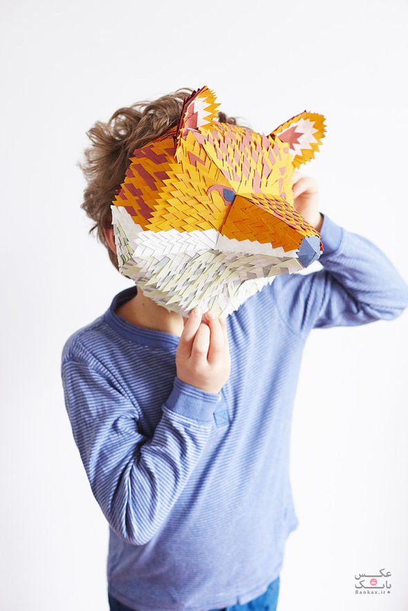 ساختن ماسک حیوانات توسط بیش از صدها تکه کوچک کاغذ/بانک عکس